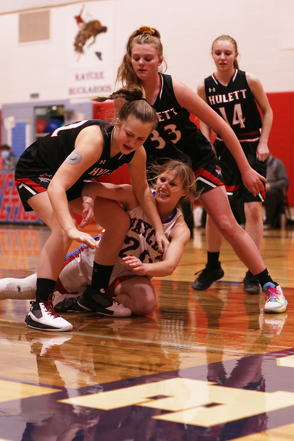 Tinley Pierson dives, passing a ball